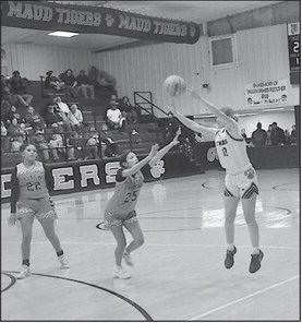 Maud Lady Tiger Aubri Kueneman takes a shot from three-point range Tuesday. Staff Photo by Bill Anderson