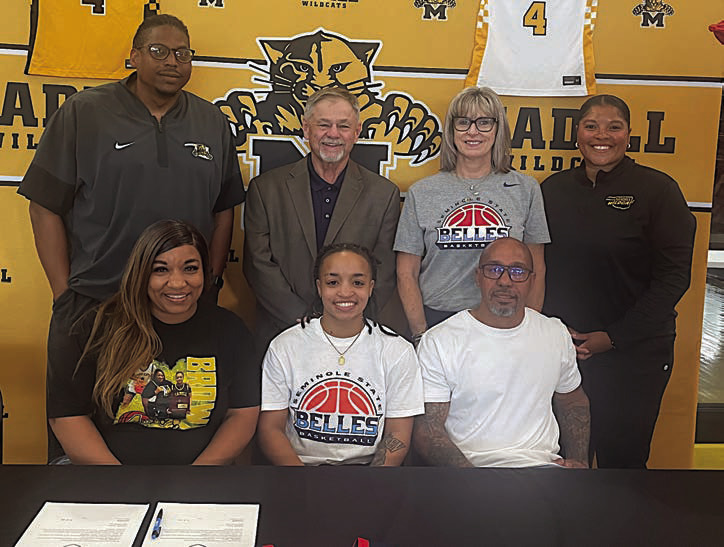 Lamiyah Brown of Madill High School has signed her letter of intent to play basketball for Seminole State. Pictured is Latoyia Brown, Lamiyah Brown, Michael Brown. Standing: Madill coach Carlos Humphrey, SSC Asst. coach Randy Wassam, Head coach Rita Story