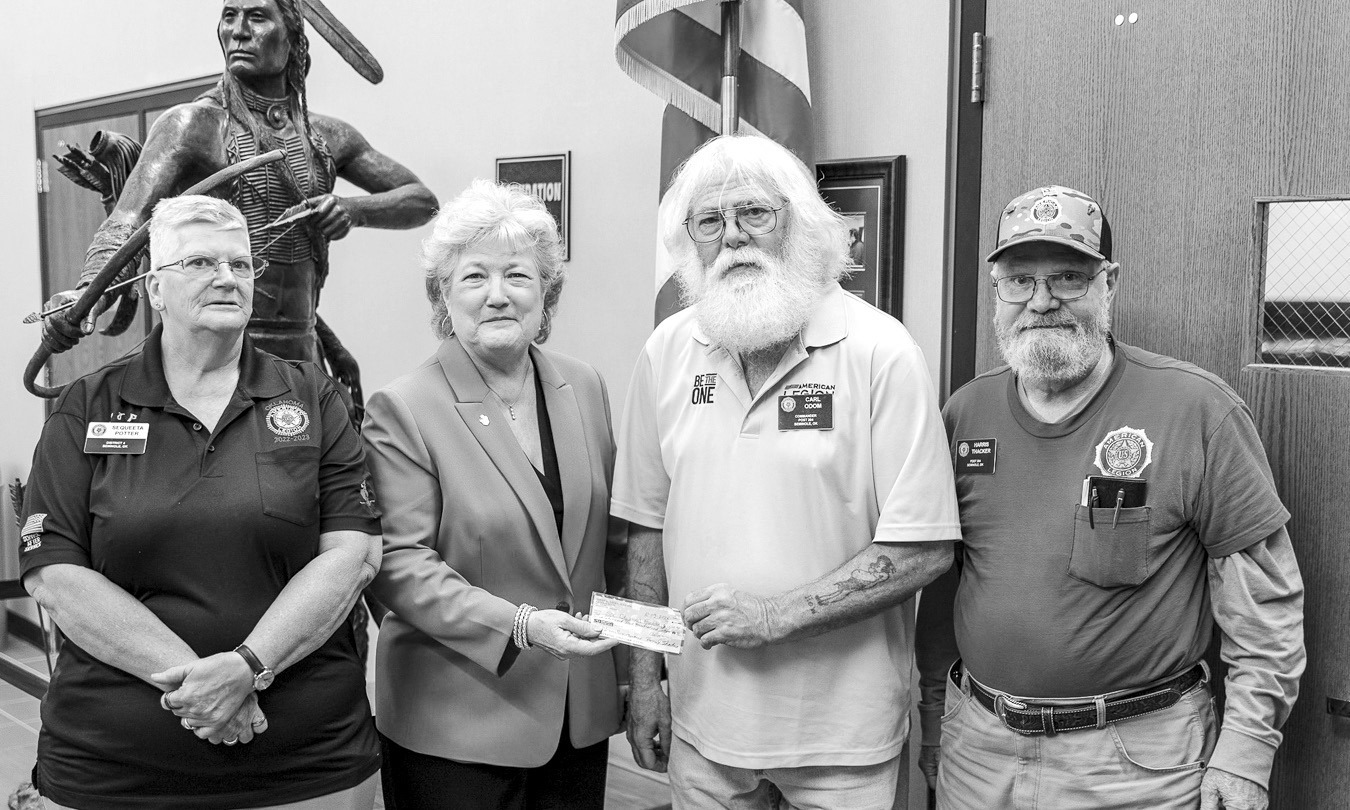 Seminole American Legion Post 204 members presented a donation to Seminole State College on Oct. 9 in support of the College’s upcoming Veterans Day activities. Pictured (from left): Sequeeta Potter, SSC President Lana Reynolds, Post Commander Carl Odom