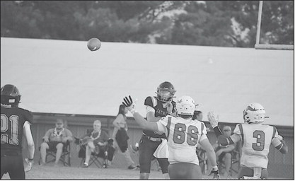 Strother Yellowjacket quarterback Mylam DeFries throws the ball to teammate Peyton Moody Friday. Staff Photo by Andy Wilson