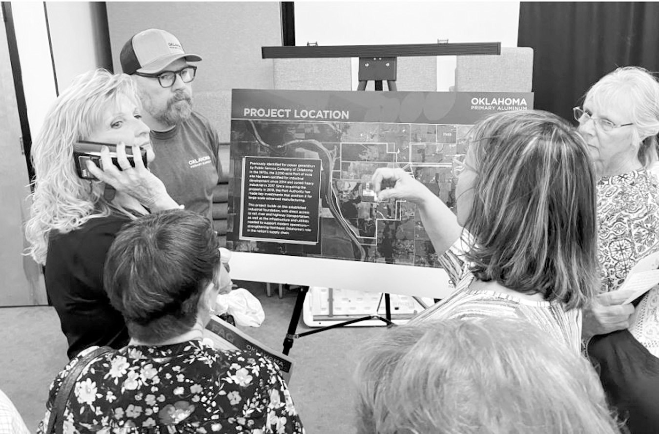 Green Country residents speak with an Oklahoma Primary Aluminum employee at a March open house. (Elizabeth Caldwell/Oklahoma Watch)