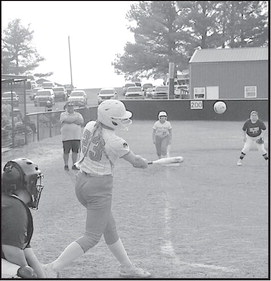 Strother Lady Yellowjacket Emily Echelle knocks one out to the outfield Monday evening. Staff Photo by Bill Anderson