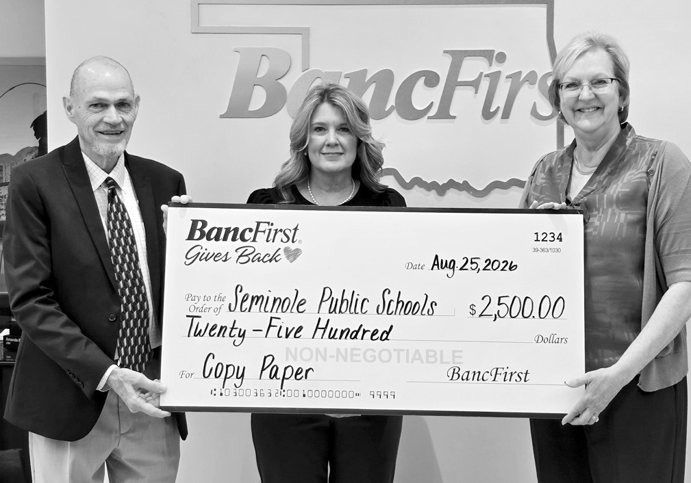 BancFirst Seminole on Tuesday donated $2,500 to Seminole Public Schools to be used for the purchase of copy paper. Pictured l-r are Superintendent Dr. Bob Gragg, Assistant Superintendent Angela Willmett and BancFirst President Debbie Kuykendall. —Courtesy photo