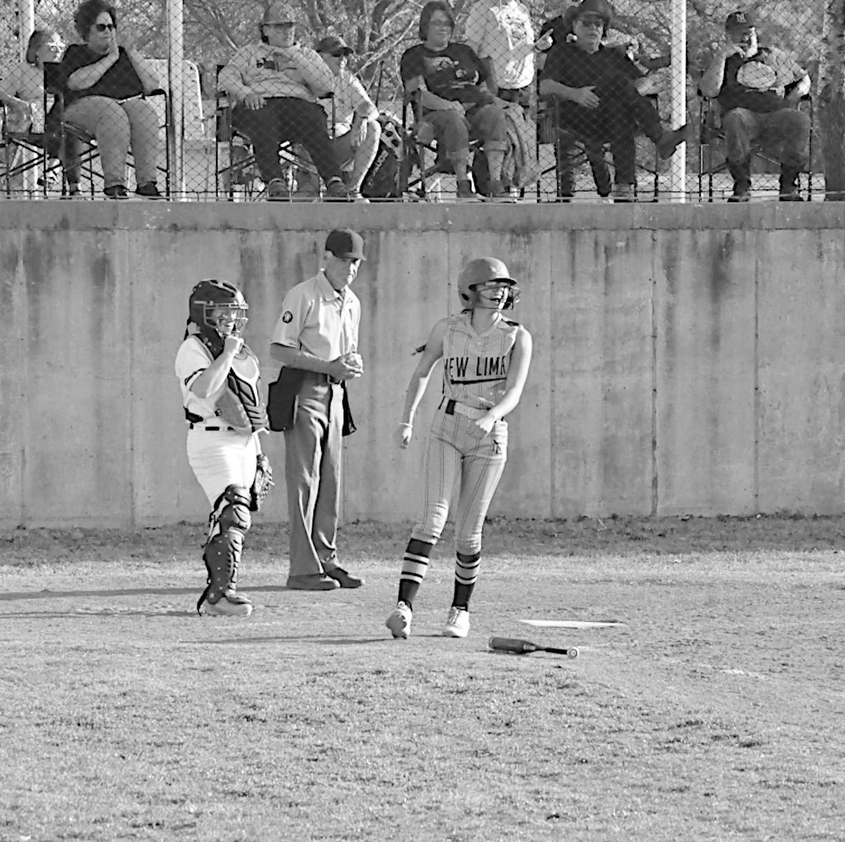New Lima Falconette Jazzy Harjo scores a run in the first inning Monday. Staff Photo by Bill Anderson