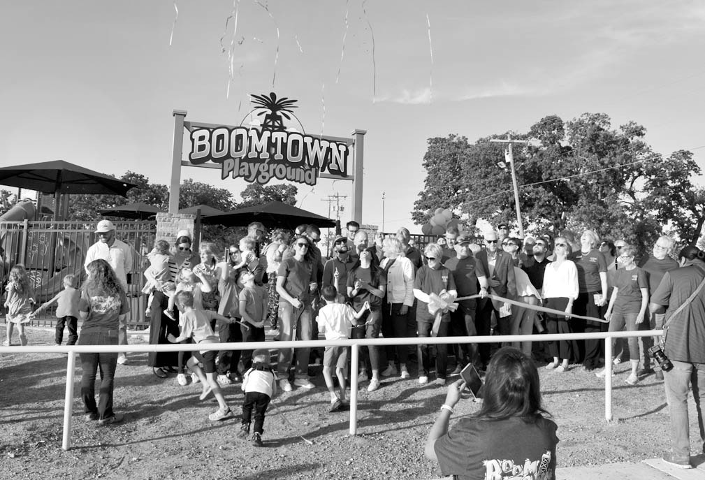 Streamers rise into the air Wednesday evening in celebration of the dedication and official grand opening of Boom Town Playground in the Seminole Municipal Park. The playground was rebuilt with funds from grants and private donations. —Staff Photo by An