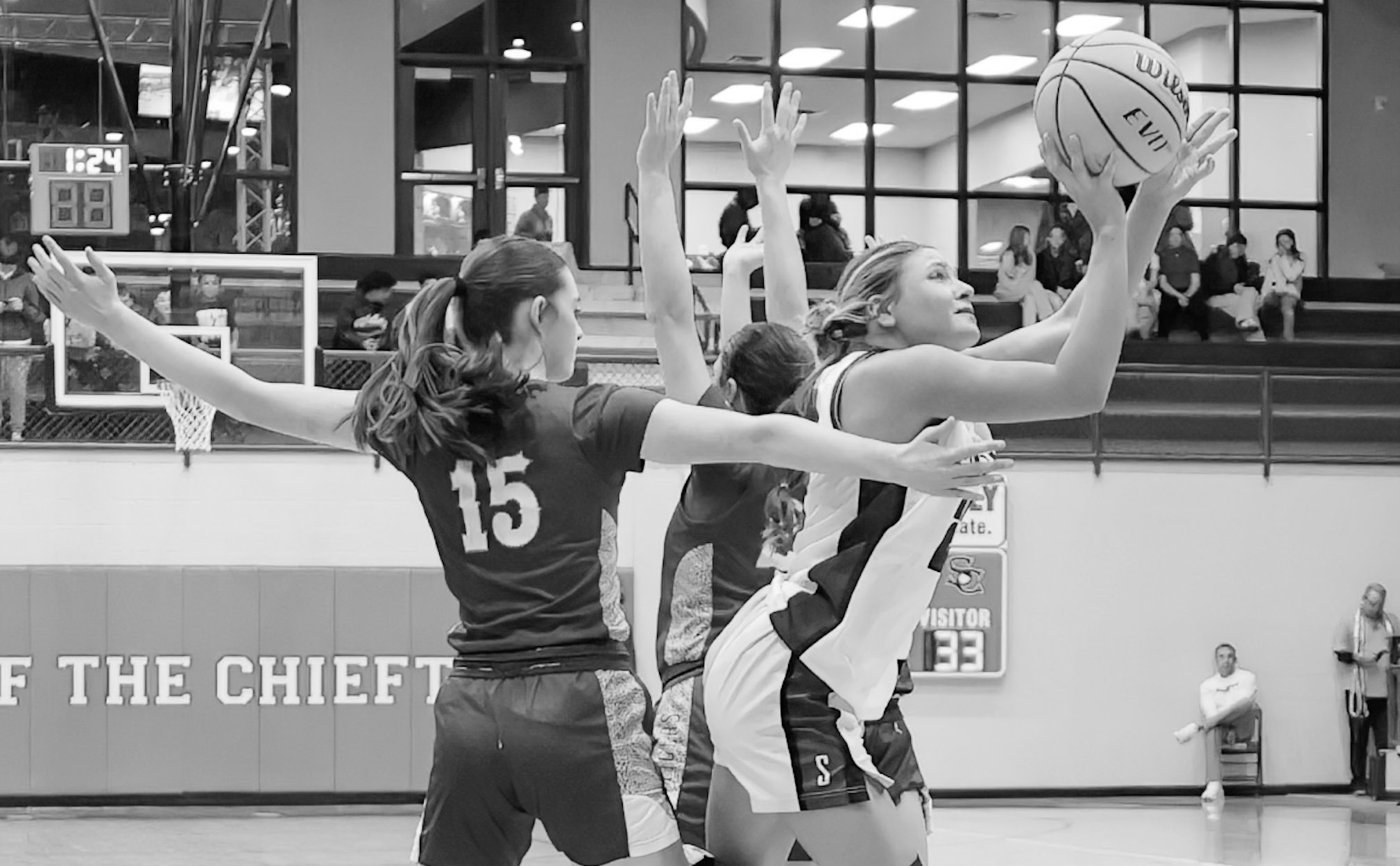 Courtesy Photo by Glen Bryan Seminole Lady Chieftain Jaxie Satawake goes in between two defenders to get a shot at the basket.