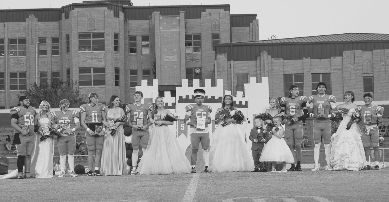 The 2026 Seminole High School Homecoming Court was revealed Friday night. L-r: Carsie Gorman, Sophomore Attendant Maggie Tucker, Ty Womack, Jaxon Williams, Sr. Attendant Maya Wilson, Carter Childs, Maid of Honor Landree Giles, King Aidan Napier, Queen Tafv Stewart, Crown Bearer Cash Dobson, Flower Girl Harper Anderson, Senior Attendant Daisy Wood, Cashawn Thompson, Dariane Loya, Jr. Attendant Adyson Coon and Alan Abrego. —Photo by Ben Schatzel