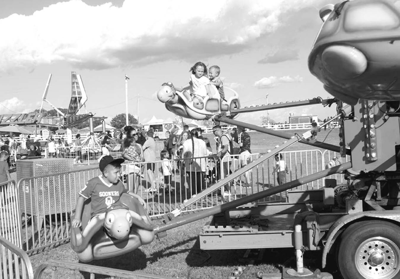 Left, kids enjoy the rides at the 2022 Seminole Nation Days Celebration, held the third week of September at the Mekusukey Mission. There are multiple events scheduled for this week, including a golf tournament, a car show, a parade, live music and a fire