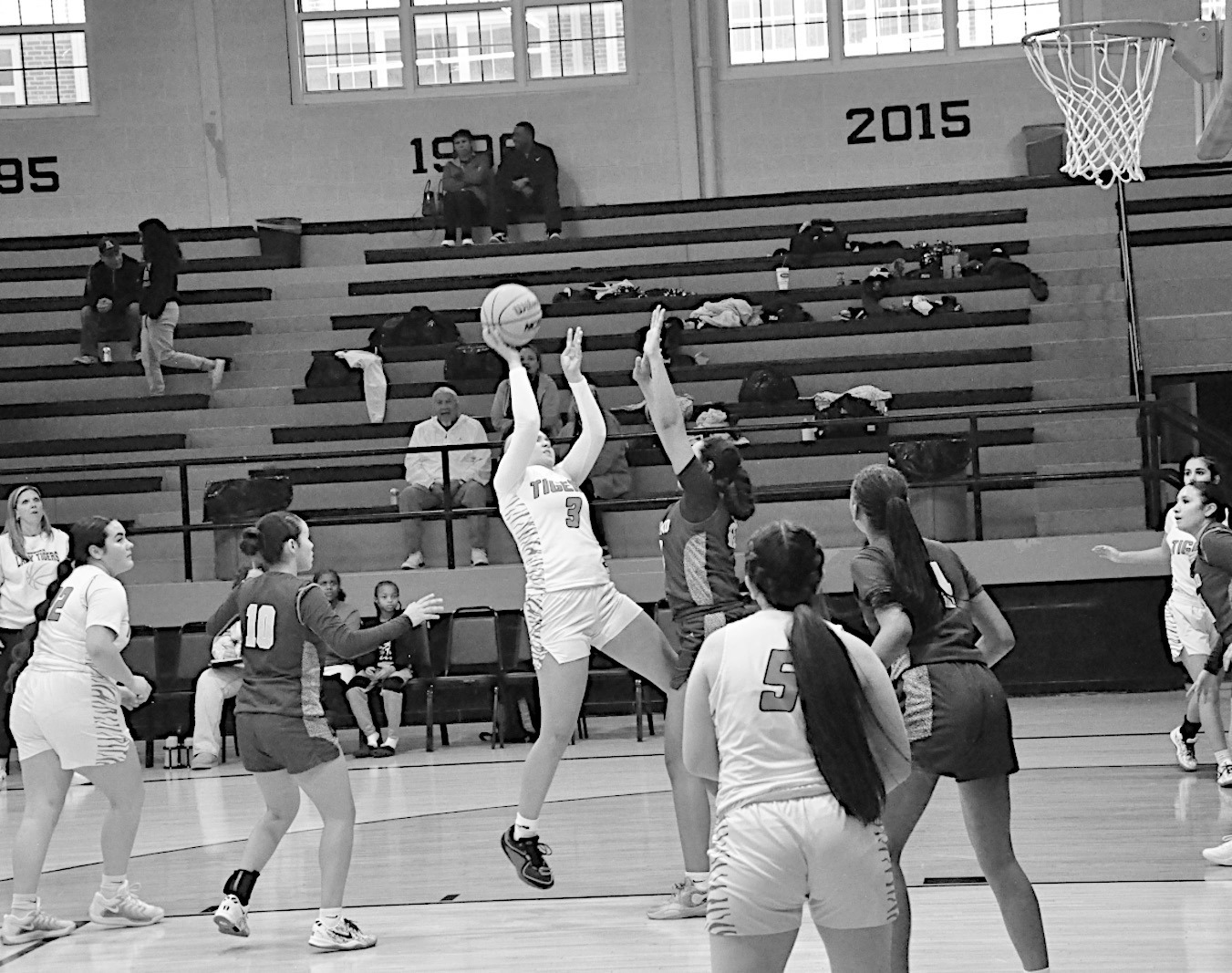 Wewoka Lady Tiger Leila Scott shoots the fade-aaway shot over the Anadarko defender Tuesday. Staff Photo by Bill Anderson