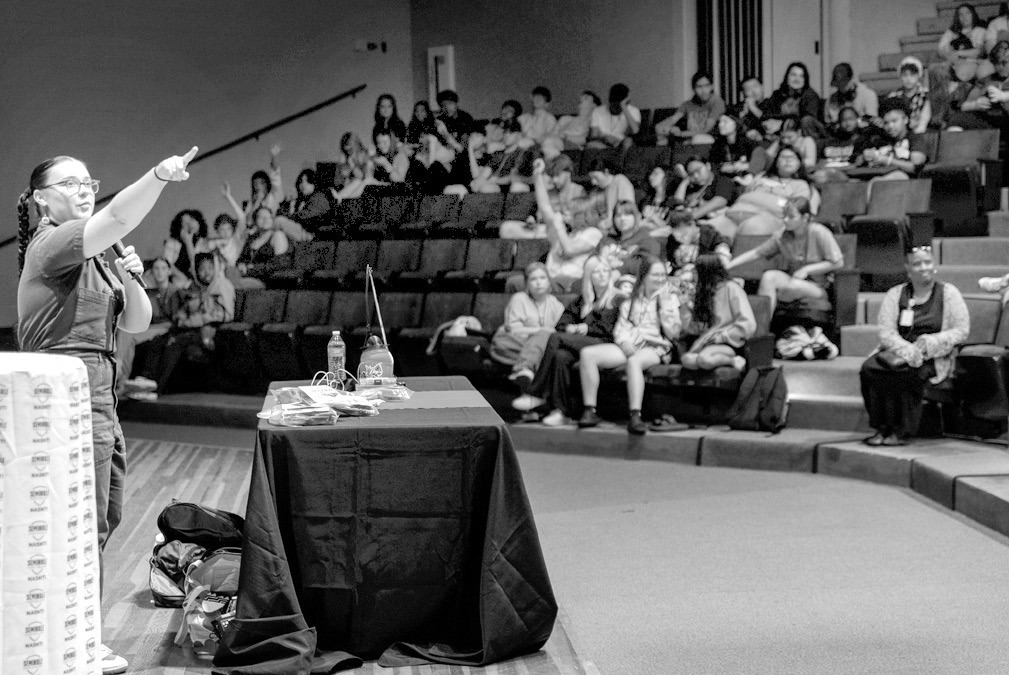 Left, Danielle Boyer, citizen of the Sault Ste. Marie Tribe of the Chippewa, speaks at the Jeff Johnston Fine Arts Auditorium on June 16. Her presentation, titled “Opportunities Through STEM,” highlighted her work in youth robotics and efforts to pres