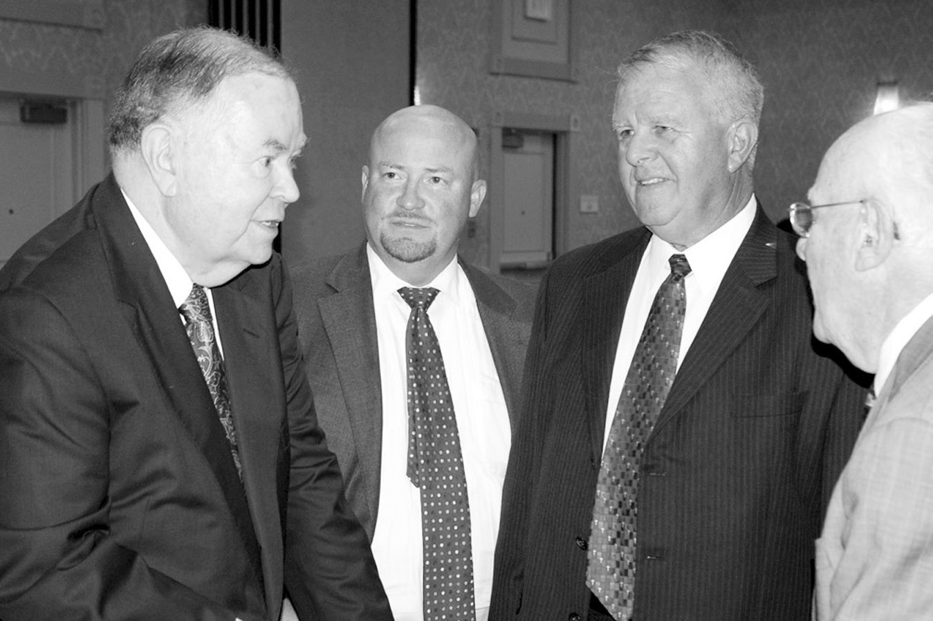 David Boren (left), who passed away Feb. 20, visits with a group of men including Joe Dorman and Seminole businessman Melvin Moran on Sept. 30, 2015 during a benefit for the Jasmine Moran Children’s Museum at the Tower Hotel in Oklahoma City. (Photo by 