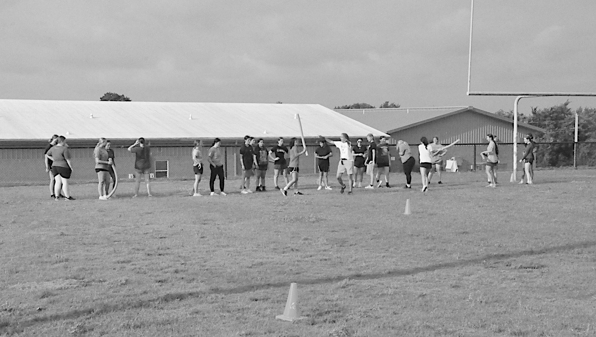Staff Photo by Bill Anderson COMMERCIAL PROPERTY-MUSTANG, OKLA. Strother Lady Yellowjackets gather outside at the football field to run drills and other skills challenges during Summer Pride.