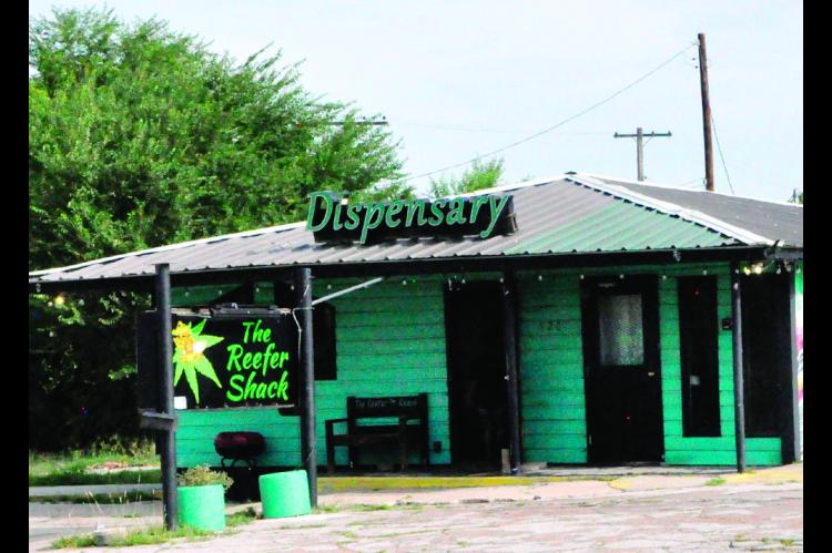 Pictured above is the Reefer Shack at 520 E. Broadway in Seminole. On Friday morning, the store was abuzz with law enforcement activity, as agents with the Oklahoma Bureau of Narcotics served search warrants on the business. (Staff photo by Bill Anderson)