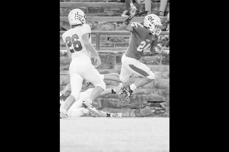 Bowlegs Bison Cylas Mack tries to go over a would be Fox tackler. Courtesy Photo by Glen Bryan
