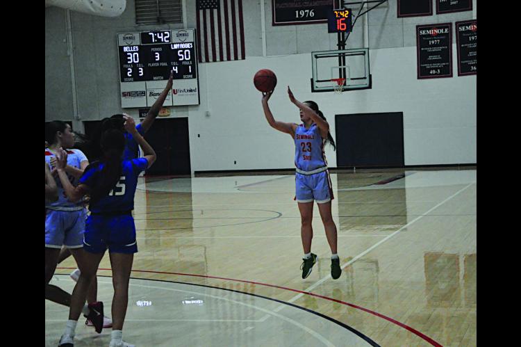 Seminole State Lady Belle Alona Cooper shoot from three-point range Thursday night. Staff Photo by Bill Anderson
