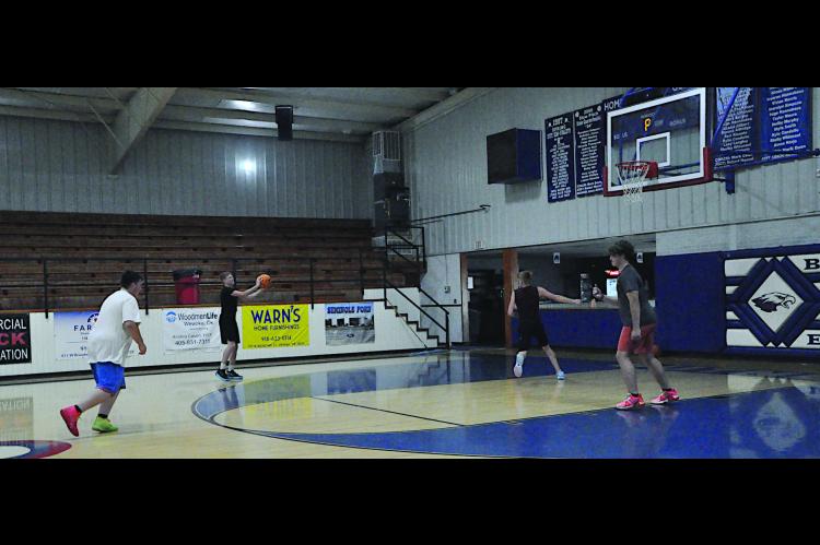 Butner Eagle basketball boys warm-up during their Summer Pride Monday morning. Staff Photo by Bill Anderson
