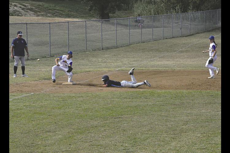 New Lima Woodrow Neal slides into third for the steal Thursday. Neal was safe and later scored on a steal of home. Staff Photo by Bill Anderson