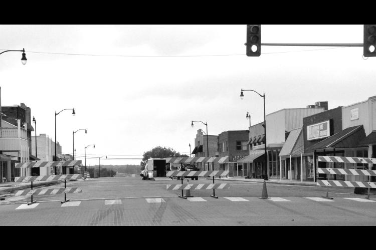 Main Street was closed from Broadway to Seminole Street Monday morning as crews began to prepare to pave over the bricks in the street. A self-leveling asphalt will be put down first followed by a thicker layer. The closure is expected to last through May