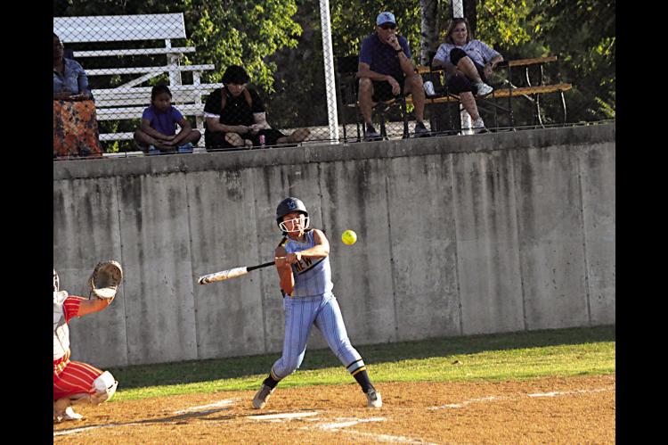 New Lima Falconette Krissy Griffis knocks the ball into the outfield Thursday. Staff Photo by Bill Anderson