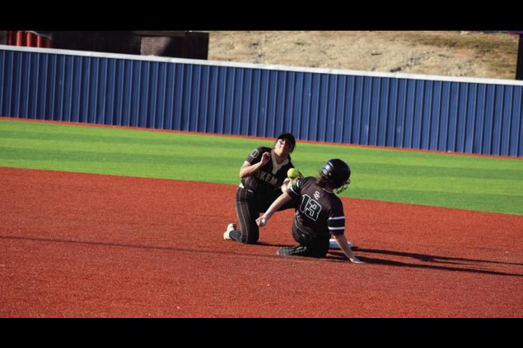 Seminole Lady Chieftain Layla Griffin slides into second base safe Monday afternoon. Staff Photo by Andy Wilson