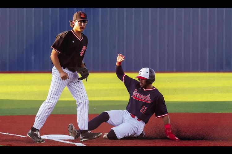 Seminole State Trojan Hunter Dearman slides safely at 3rd base Thursday night. CourtesayPhotobyGlenBryan