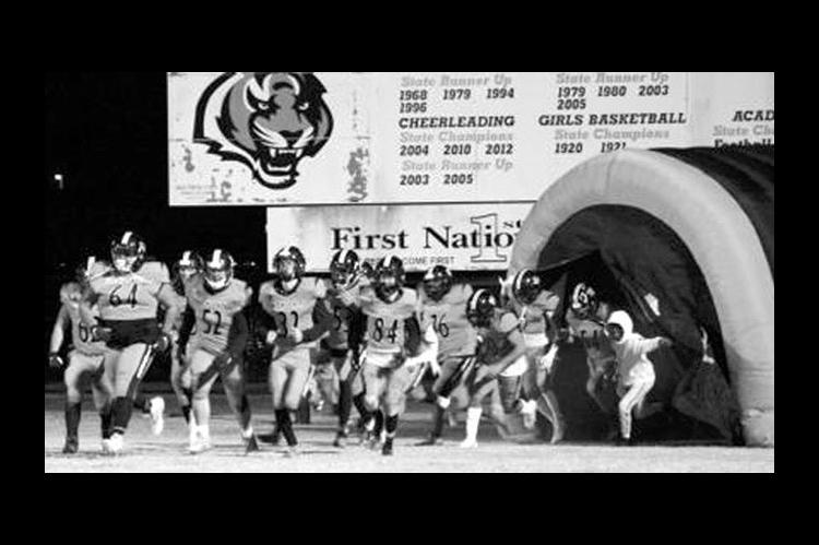 The Wewoka Tiger football team is seen entering the stadium in this file photo. The Wewoka Public School District says security will be beefed up as Wewoka takes on Konawa in tonight’s season opener.