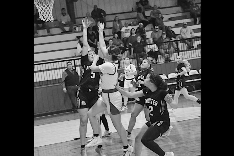 Bowlegs Lady Bison Cira Parsons drives in for the shot against Schulter Friday night. Bowlegs won 47-27. Staff Photo by Bill Anderson