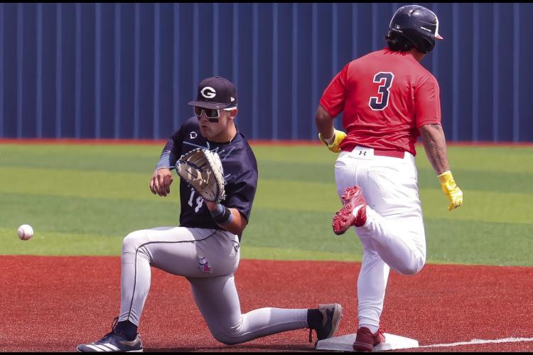 Seminole State Trojan Daniel Restrepo beats the throw to first base Monday afternoon. Courtesy Photo by Glen Bryan