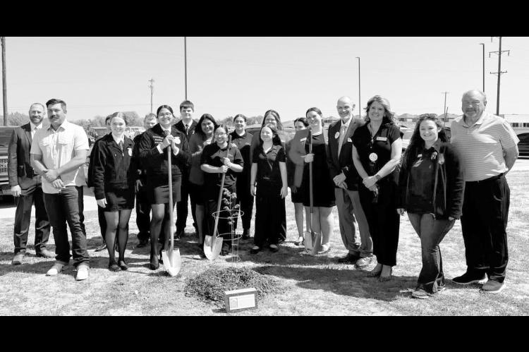 Above, Seminole FFA, FCCLA students and community members plant a “Survivor Tree” sapling at the high school on Wednesday following an assembly held to commemorate the April 19, 1995 bombing of the Murrah Federal Building in Oklahoma City, —Courtesy