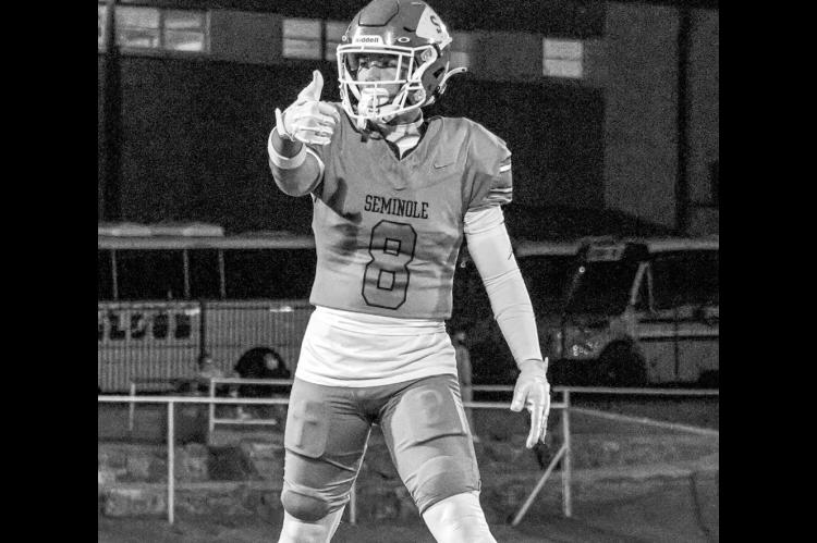 Seminole Chieftain wide receiver Austin Smith lines up before a play in Friday night’s matchup with the Checotah Wildcats. Friday was the season opener for the Chiefs, and they walked away with a 34-27 victory. See page 5 for more. —Staff photo by Ben