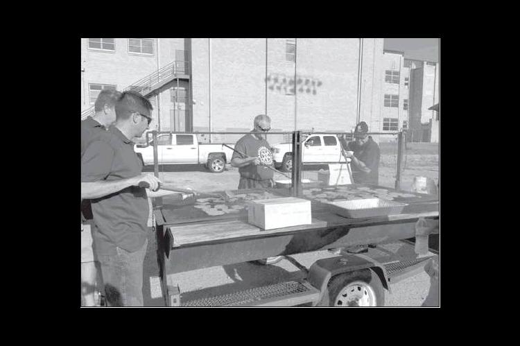 Rotary hold annual hamburger cook out
