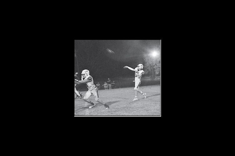 Bowlegs Bison quarterback Tyler Lee finds a receiver for a huge gain. Staff Photo by Bill Anderson