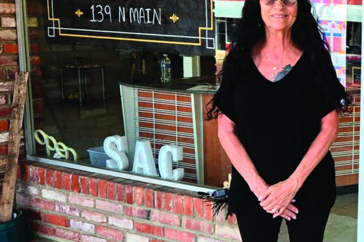 Left, Seminole Arts Council Program Director Deborah Davis is pictured in front of the Seminole Art Center at its new location at 139 N. Main. The larger building has more space for the increase in activities the Arts Council sponsors. The public is invit
