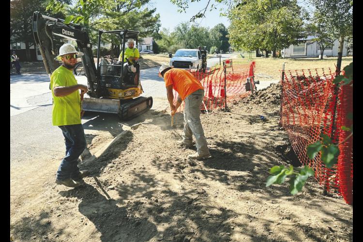 Crews were busy Friday morning on Harding Street just north of Hoover digging trenches for new natural gas lines that are being installed by Summit Utilities. The project is ongoing in the surrounding neighborhoods. —Staff Photo by Mike Gifford