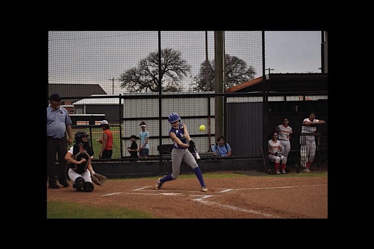 Bowlegs Lady Bison MaryBeth Dunagan knocks the ball out to the outfield Tuesday. Staff Photo by Andy Wilson