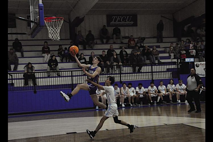 Bowlegs Bison Tyler Lee flies in for the layup Thursday afternoon. Staff Photo by Bill Anderson