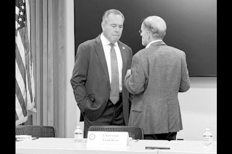 Oklahoma Treasurer Todd Russ, left, talks with Mark Wood, director of the Office of Management and Enterprise Services, before a meeting of the State Pension Commission at the Capitol in Oklahoma City on Tuesday, Sept. 1, 2026. (Paul Monies/Oklahoma Watch)