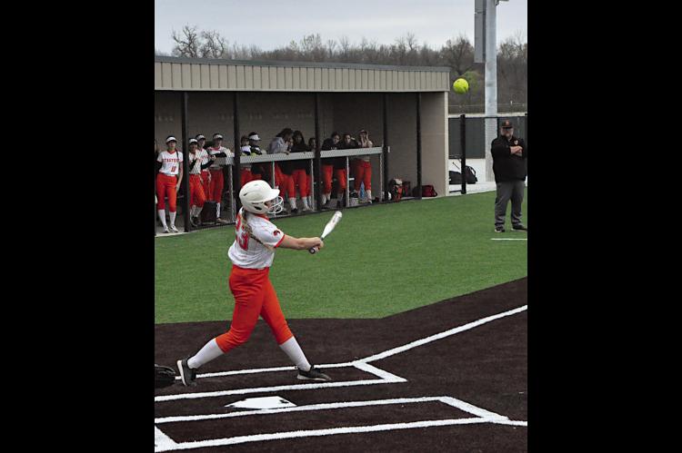 Strother Lady Yellowjacket Emily Echelle knocks one out to the outfield. Staff Photo by Bill Anderson