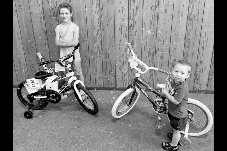 Kallan Wiggins and Christian Dodson were the grand prize winners of shiny new bicycles donated by Walmart in the Seminole Public Library’s Summer Reading Program. Over 60 kids participated in this year’s program. —Courtesy photo