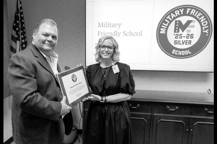 SSC Board of Regents Chair Curtis Morgan (left) presents the Military Friendly Silver Status Award to VA School Certifying Officer Stacey Foster (right) during the Board meeting on March 27. Foster was recognized for her instrumental role in helping the C