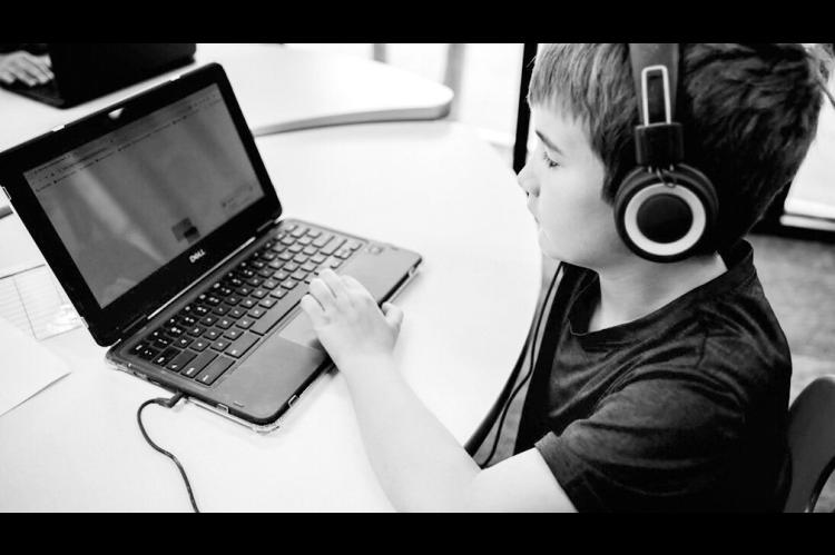 A student works on a computer at Alpha School in Austin, Texas. Alpha School advertises 2-hour, daily learning blocks customized by AI followed by hands-on projects and life skills lessons. It’s on track to open locations in Edmond and Tulsa this fall. (Photo provided by Alpha School)