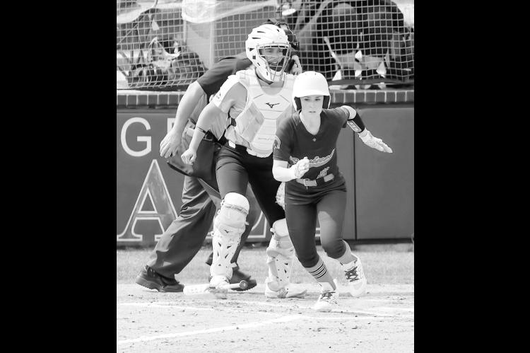 Seminole State Lady Trojan Mckayla Greenshaw heads for first base after she gets the hit. Courtesy Photo by Glen Bryan