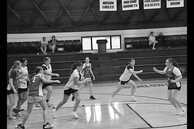 Butner Lady Eagles and Bowlegs Lady Bison participate at the basketball camp Monday. Staff Photo by Bill Anderson
