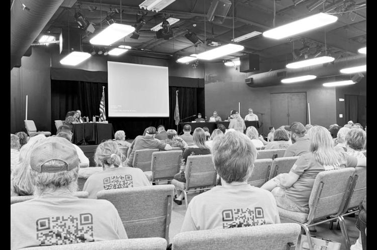 Hundreds of people gathered for a board of trustees meeting at Inola High School June 29, 2026. At Monday’s meeting, Inola’s mayor and the board officially hit pause on zoning approvals for a proposed $4 billion aluminum smelter, which has backing by President Trump. (Photo by Graycen Wheeler/KOSU)