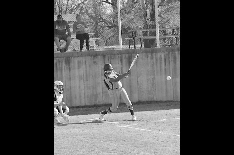 New Lima Falconette Aubrey Washington knocks one out to the infield. Staff Photo by Bill Anderson