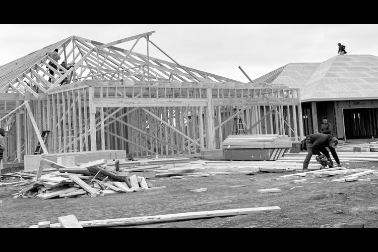 Construction workers frame a duplex in Tuttle, being built by Silva Development as part of Oklahoma’s new Housing Stability Program. (Heather Warlick/Oklahoma Watch)
