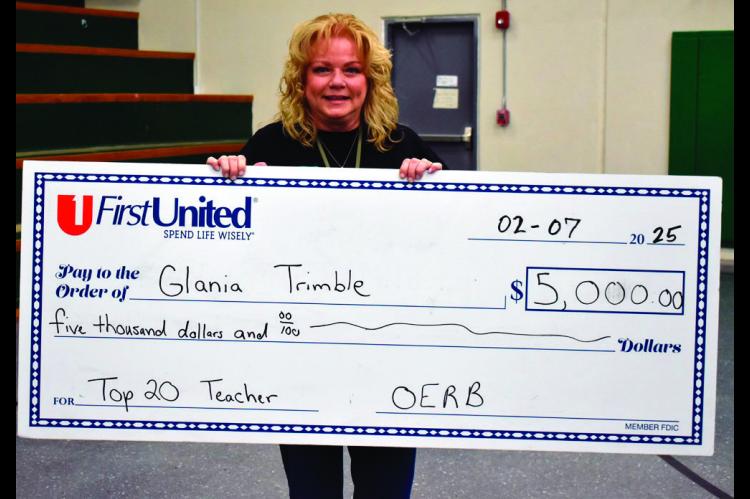 Glania Trimble was presented with a $5,000 check Friday. (Staff photo/Andy Wilson)