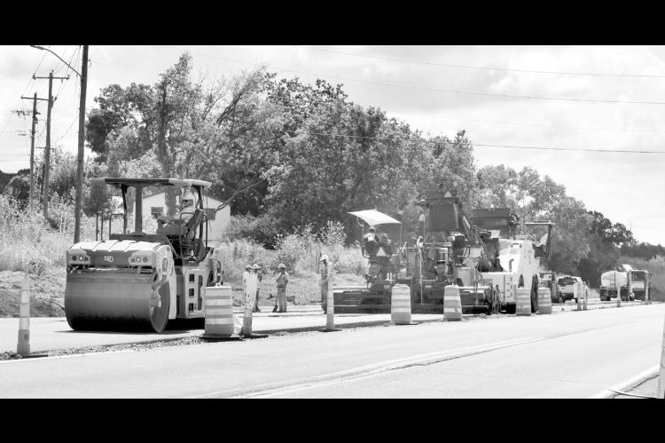 Heavy equipment was out in full force Monday morning, paving the turn lane from Highway 270 into Harvey Road. The widening of 270, which began about 10 years ago, appears to be getting closer to completion. When finished, the highway will be four lanes from Seminole to Wewoka. —Staff Photo by Andy Wilson