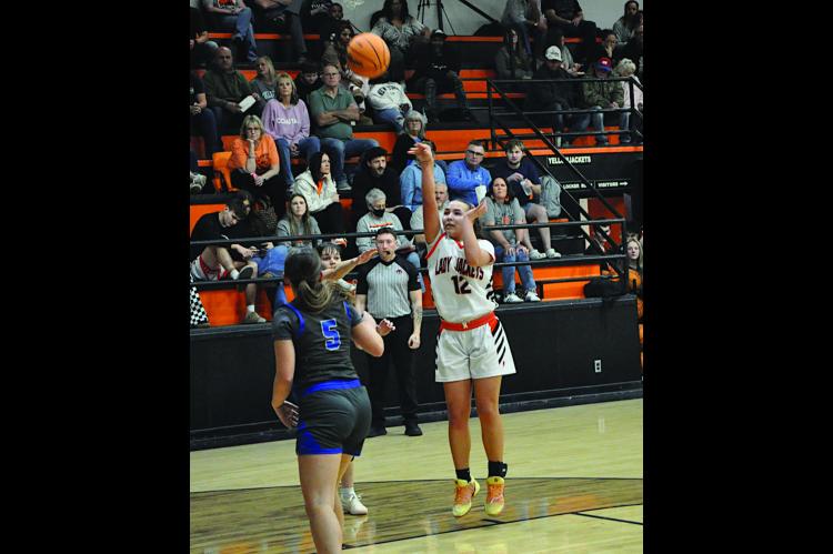 Strother Lady Jacket Olivia Speers makes the jumper Thursday night. Staff Photo by Bill Anderson