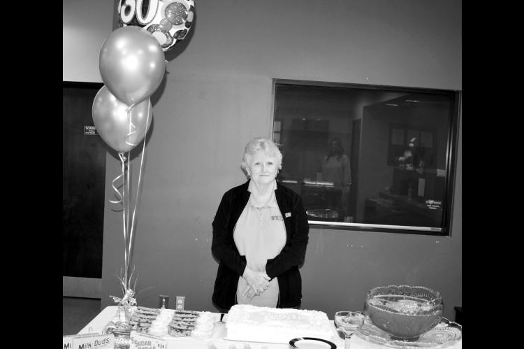 Cheryl Stinnett, loan processor at Security State Bank in Seminole, recently celebrated 30 years of service with the bank. The bank staged a reception in her honor that included cake and other treats. —Staff Photo by Andy Wilson